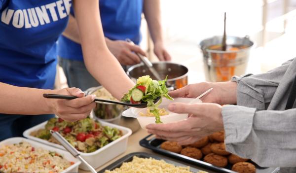 Image of volunteers serving meals